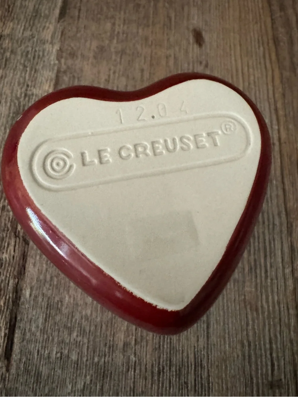 Red Le Creuset heart-shaped stoneware ramekin